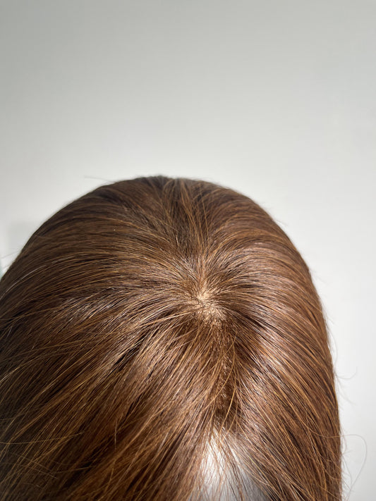 a silk base wig with hidden knots and scalp like looking